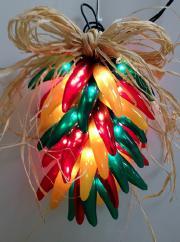 Fiesta Ristra Red/Green/Yellow Try a tradition of the southwest with one of our lighted chili ristras, complete with a raffia bow and a raffia hook for hanging.