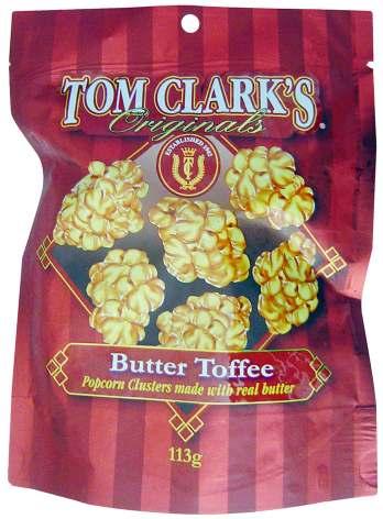 Tom Clarks Originals Butter Toffee Tom Clark Confections Australia Event Date: Jul 2013 Price: US 4.24 EURO 2.98 Description: clusters with butter toffee flavor, in an easy-tear pouch.