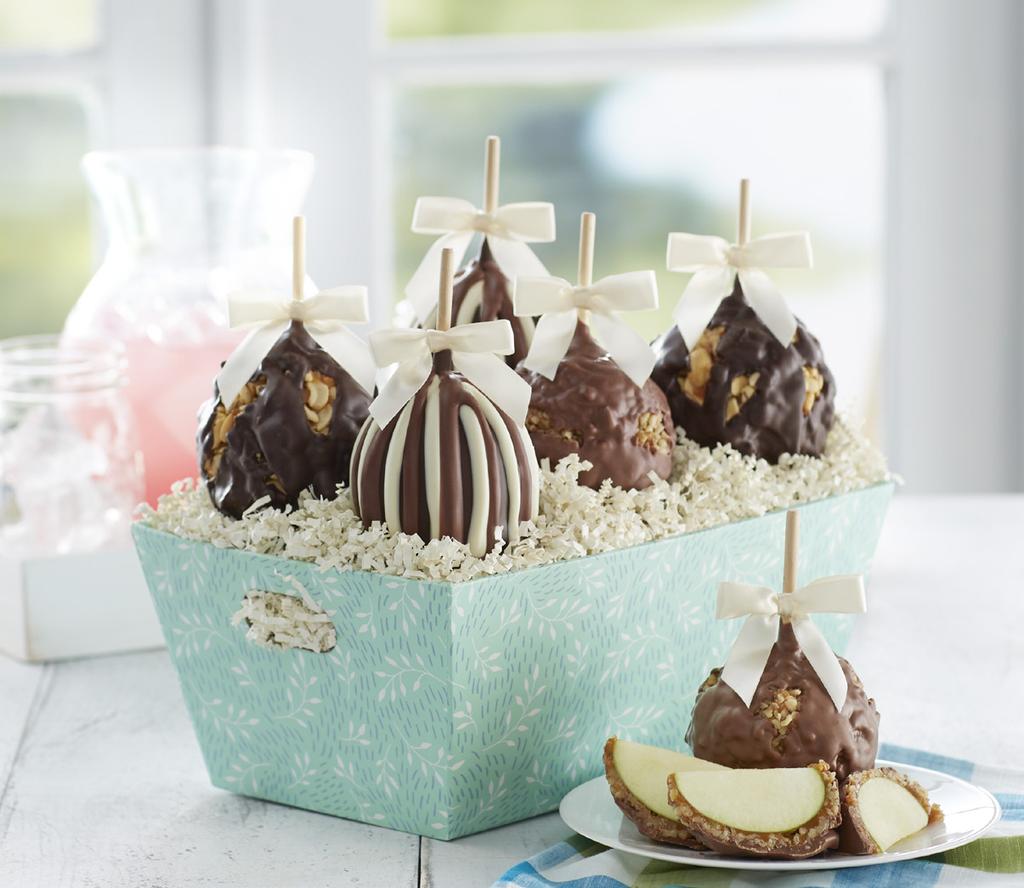 99 Spring Petite Caramel Apple 4-Pack Celebrate spring with four delicious Petite Caramel Apples decorated with pink and green bows.