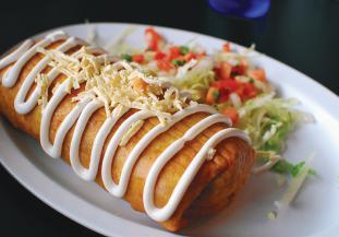 Topped with lettuce, tomatoes, guacamole and sour cream Flautas TOSTADAS $ Two crispy corn tortillas topped with refried beans and