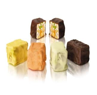 Sugary almond and pistachio filled pralines Pistachio slivers and almond nougat chocolate pralines Nougats Extraordinary masterpieces of confectionery
