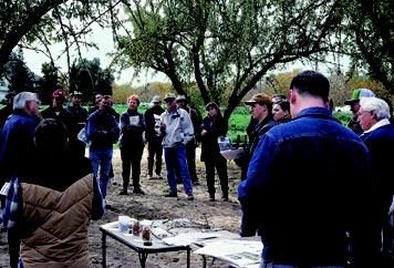 Participants in the Biologically Integrated Orchard Systems (BIOS) program attend field days, such as this one in Hopeton, to learn how to avoid the use of broadspectrum insecticides.
