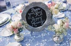 Reception Table Décor: 5 foot round table that seats 8 people Blue stone table cloth with white lace overlay 8 silver