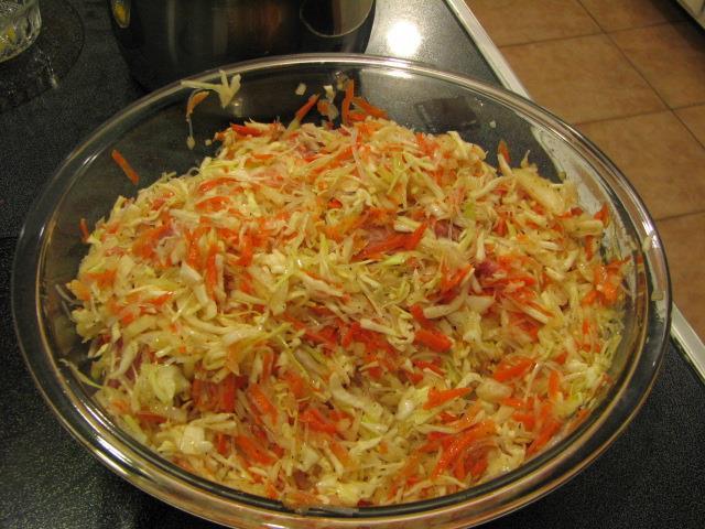 Add the 3 cups of shredded carrots, 2 cups minced onions, salt, pepper, garlic, cooked/drained noodles