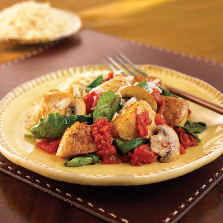 4 skinless, boneless chicken breast halves, cut into " pieces 2 cloves garlic, minced can (5 oz) diced tomatoes, drained bag (5 oz) baby spinach 2 cups thinly sliced mushrooms ½ cup Parmesan cheese,