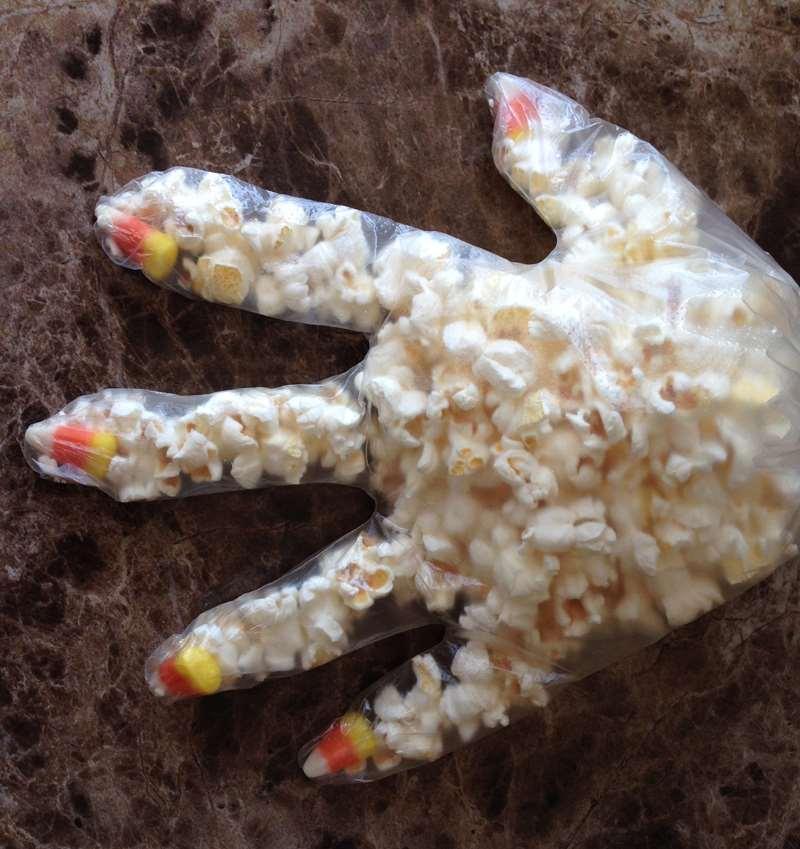 Idea #11: Creepy Candy Corn Popcorn Hands This is a creepy little party treat or decoration and all it requires is a plastic glove, candy corn, some popped corn and a