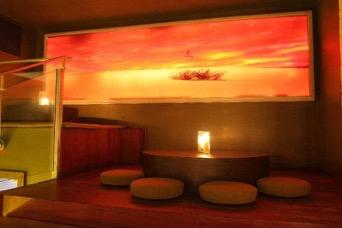 looking to escape the energy of the bar and steal a moment alone. Two mammoth California style fireplaces create a nice ambiance for the 10-15 diners that the lounge is able to accommodate.