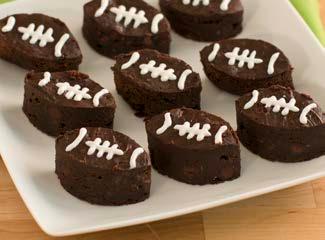 Football Brownies 1 (15 ounce) can black beans, undrained 1 package Truffle Fudge Brownie Mix White decorating icing with narrow tip Special Equipment: 2¹ ³ x 1¹ ³ -inch football-shaped or oval