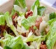 00 Cos lettuce, bacon bits, boiled egg, shaved parmesan cheese and dressing.