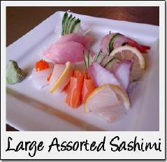 00 Bowl of sushi rice topped with a variety of sashimi and