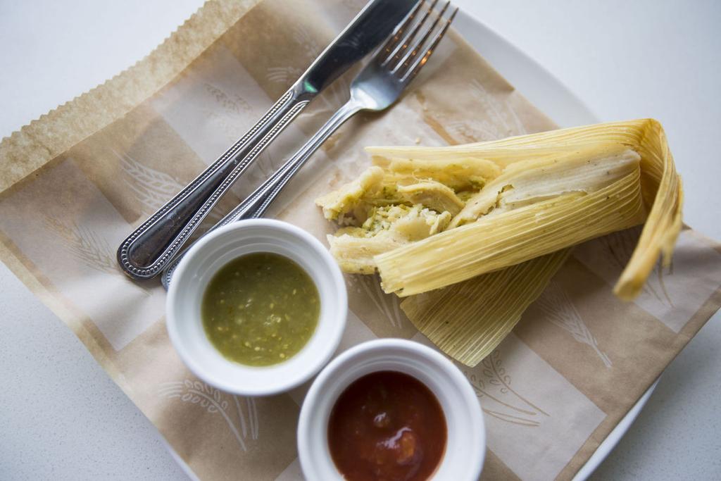 Tamaleria El Poblano makes the tamales at Café Social, including this pork tamale with green and red salsas. Buy Now The rest of the menu is in food from local producers who he knows well.