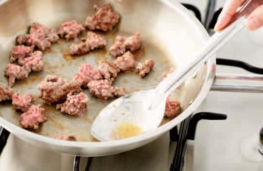 As the mince cooks, tilt the pan slightly and spoon away the liquid; this helps brown the mince and also ensures the sauce does not have a fatty taste.