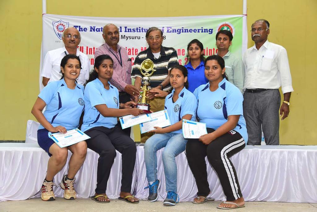 Women Winners: VVCE Women team receiving the Winners trophy from left to right: Sri.Shankaranarayana, Convener of the Championships. Dr.R.