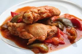chicken cooked with herbs and tomatoes served