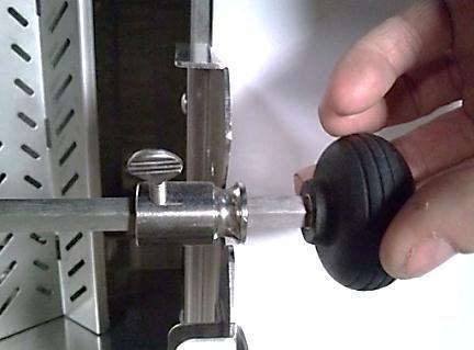 Slide the rotisserie rod bushing over the opposite end of the rod and drop into the cut-out provided in the RH side
