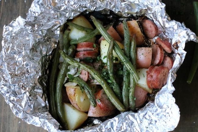 MAIN DISHES MAIN DISHES CAMPFIRE SAUSAGE & POTATOES INGREDIENTS: 1 package Turkey Sausage, sliced 6 Red Potatoes, cut into bite size pieces Fresh Green Beans 1 Onion, chopped 4 tablespoons