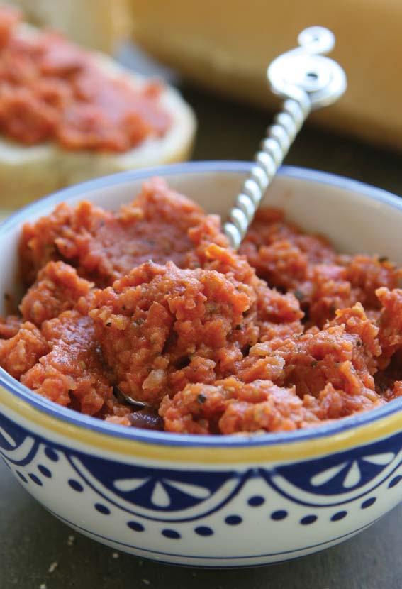 Yield: 8 Servings Rustic Tomato Spread 2 pounds Florida cherry tomatoes, halved 6 garlic cloves, chopped ¼ cup olive oil 1 teaspoon salt Freshly ground black pepper 2 tablespoons parmesan cheese