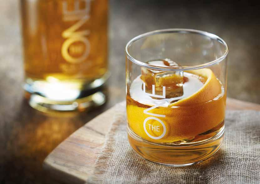 OLD FASHIONED GLASS/ICE Rocks glass, cubed ice 50ml The ONE British Isles Blended Whisky 1 bar spoon of sugar 1 piece of orange peel 3 dashes of Angostura