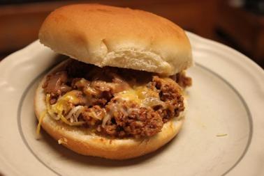 Pizza Burgers Ingredients: 2 lbs ground beef or turkey (browned) 1 small onion, chopped 24 oz of tomato sauce (I used 3 8oz cans, because
