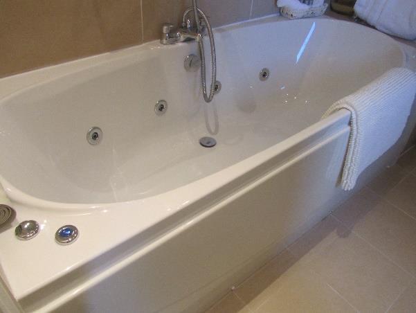 Bath height 2ft / 60cm with powerful hand held shower attachment.