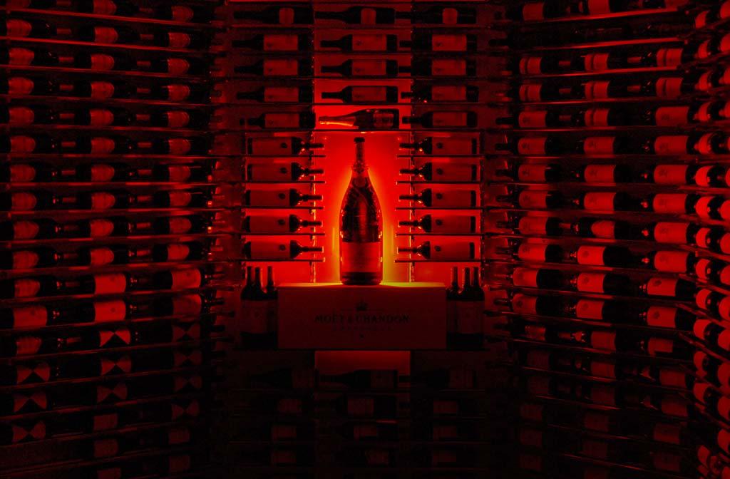 How was this wine cellar designed? This installation is the same as the previous but was photographed in the dark to show the dramatic lighting employed in the room.