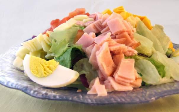 Salads Salads served half or full size pans. Priced individually. Chris Special Garden-fresh lettuce with smoked ham, turkey, American and Swiss cheeses, hard-boiled egg and tomato 7.