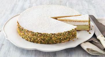 Cakes - Signature RICOTTA & PISTACHIO CAKE Pistachio and ricotta creams separated by sponge cake, decorated with pistachio pieces and dusted with