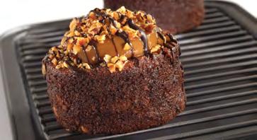 Single Servings - Pastries & Mousses CHOCOLATE CARAMEL CRUNCH A flourless chocolate cake filled with crunchy almond bits, topped with creamy caramel
