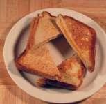 SANDWICH, GRILLED CHEESE (FLAT GRILL) - 83128 20 minutes - prepared 1 Tablespoon Butter Blend Sunglow 1/2 oz Ladle 2 Slices Toast Texas White S/S metal spatula 2 Slices Cheese American 1 Ladle