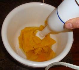 To eliminate watery pumpkin I strain my pureed pumpkin through a cloth overnight. If I use frozen pumpkin I do the same again as it thaws out. It works great and my pies cook beautifully.