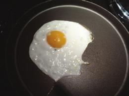 In the picture below, the egg white has changed from to white and the whole egg has changed from a to a.