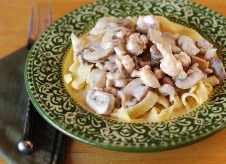 7 5 When the noodles are cooked and drained, plate individual servings topped with the chicken and mushroom cream sauce.