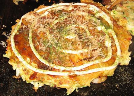 Food - Okonomiyaki おこのみやき Okonomiyaki ( おこのみやき ) is a Japanese savoury pancake containing a variety of ingredients.