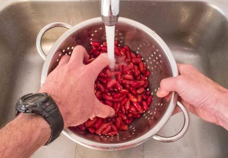 Pour the presoaked beans into a colander or
