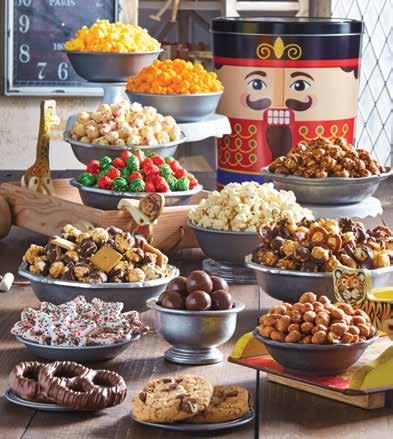 Serves 12-14. C08501 $79.99 A B NUTCRACKER TIN PREMIUM SNACK ASSORTMENT new! Let this variety of flavors leap across your palette. Our Nutcracker fairies have filled this 3.