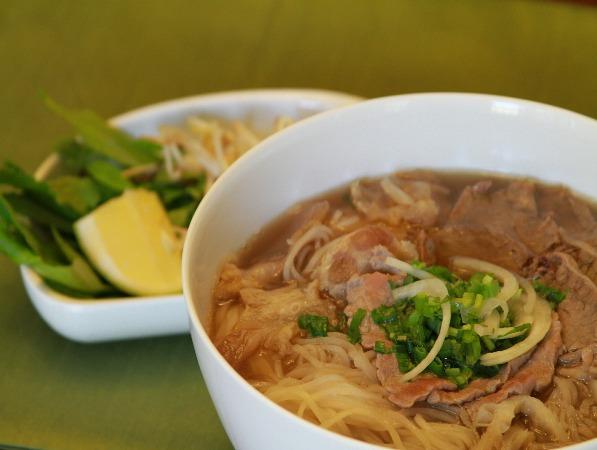 Phở tái* nạm gân sách Beef noodle soup with rare eye round steak*, flank, tendon, and tripe 16.