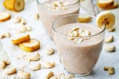 TROPICAL BREAKFAST IN A CUP [Serves 2] 1-2 tbsp. of coconut oil 2 frozen bananas ½ cup gluten-free rolled oats 1 cup almond or coconut milk ½ cup raw almond butter 1 tbsp.
