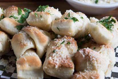 99 PETE S FAMOUS KNOTS PETE S FAMOUS KNOTS Our famous pizza dough is tied, baked and tossed in a garlic butter glaze, then topped with fresh parmesan cheese; also available with cinnamon sugar glaze.
