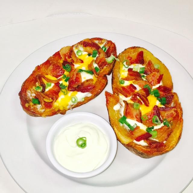 crispy potato skins topped with mozzarella, cheddar cheese, crispy bacon, scallions and served with sour cream Blend of sour cream, crispy bacon, green onions and cheddar, served with crispy seasoned