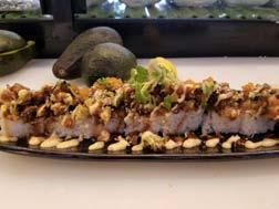 85 Unagi, krab meat, asparagus, avocado roll topped with coconut and spicy creamy unagi Baked Topping Rolls 47. Dynamite Roll 12.
