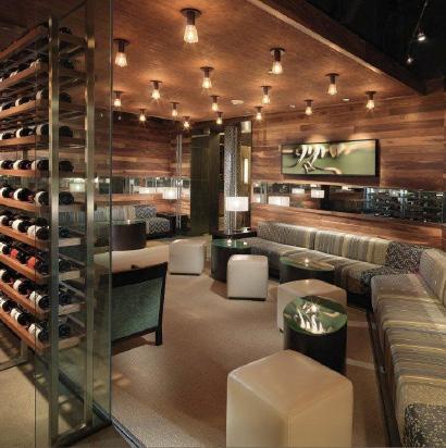 The Bottle Lounge, separated from the main venue by a beautifully lit bottle wall, offers plush seating and cocktail tables and serves as a great