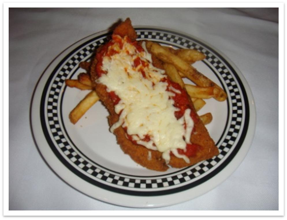 KIDS CHICKEN PARMIGIANA KIDS PLATE B - Breaded chicken Napolitana sauce, hot Shredded cheese ½ portion 2 oz. vol. ¾ oz. wt. 1. Take chicken and cut in half. Place half in fryer and cook for approx.