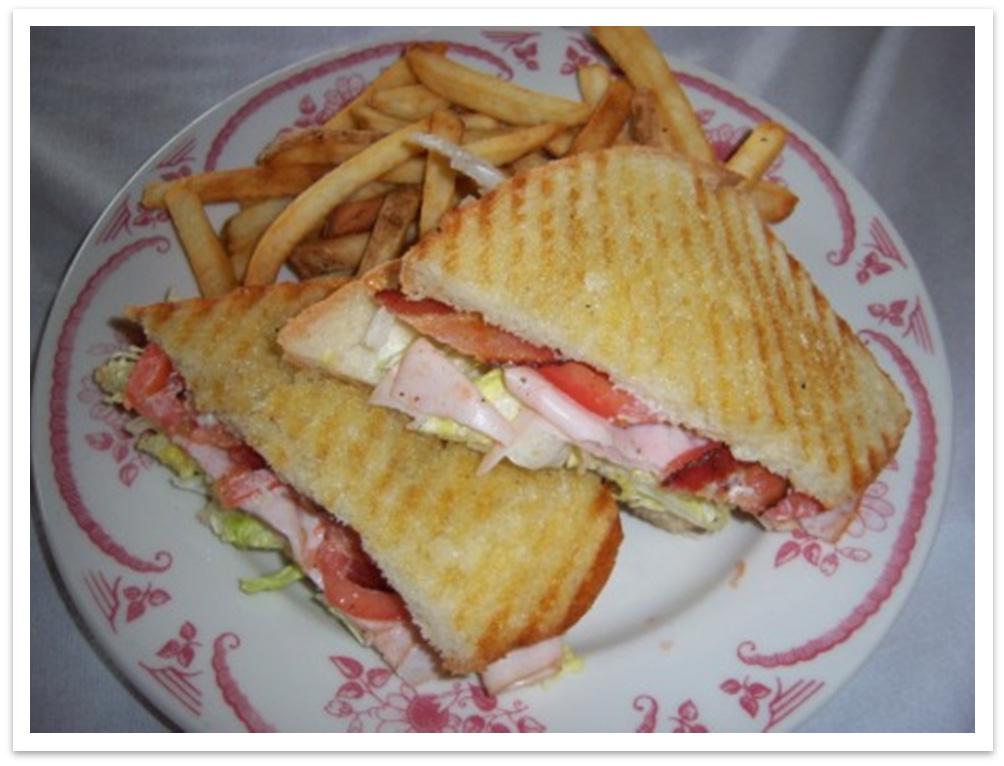 TUSCAN TURKEY CLUB OLD WORLD PLATE AMERICAN ROSE WITH FRIES Tuscan bread 2 slices 1. Brush outside of slices of bread with margarine place in panini press to toast 1 side.