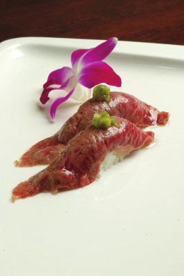 99 lightly torched slice beef on a bed of red onion with tongarashi and sea salt, olive oil &