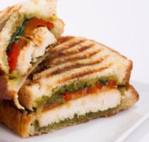 RECIPES PESTO CHicken Panini INGREDIENTS 1 boneless, skinless chicken breast, pounded thin 6 strips jarred roasted red pepper 4 tbsp jarred pesto sauce 1 handful arugula, washed 4 slices Italian