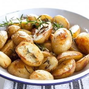 roasted rosemary potatoes Yield: 2 servings You will need: cutting board, knife, baking sheet, parchment paper, mixing bowl, mixing spoon 2 red potatoes 2 tsp olive oil 2 sprigs fresh rosemary,
