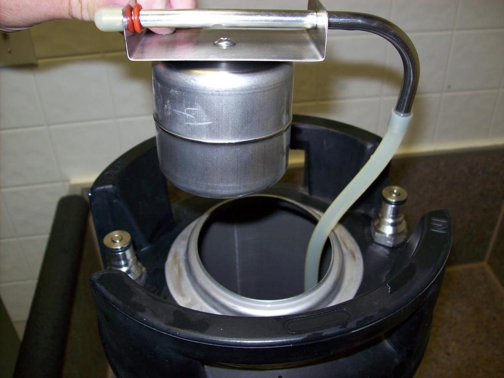 Now remove the lower end of the tubing from the keg so it can be attached to the stainless tube. The float assembly positioning in this picture is very important.