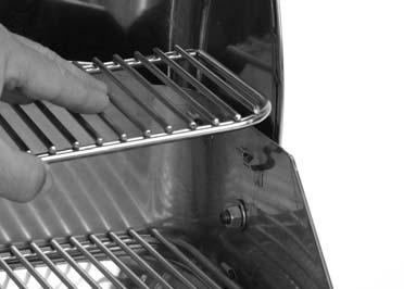 down on grate to lock into tabs on left side of grill. (Fig.