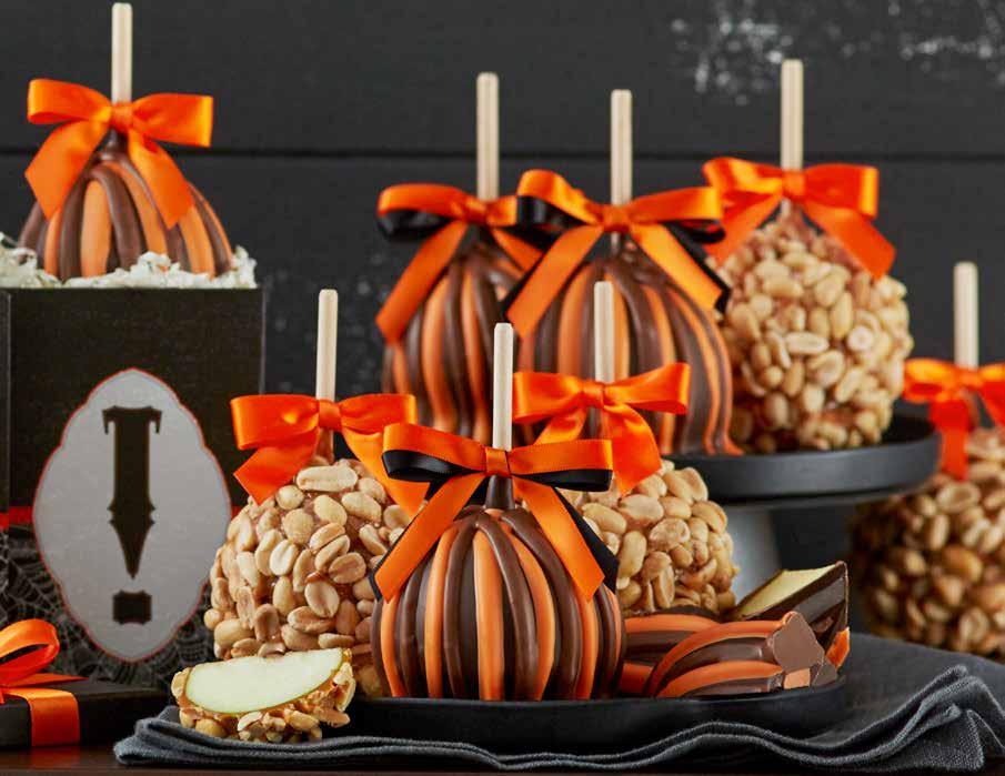 Four Halloween Triple Chocolate Caramel Apples are elegantly striped to make a delicious autumn gift. #1930806 $36.