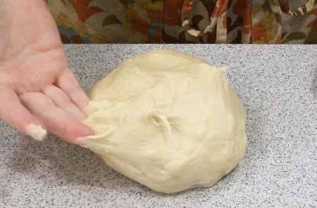 The ideal texture I prefer to see is the dough pulling away from the sides of the bowl but still sticking in the bottom.